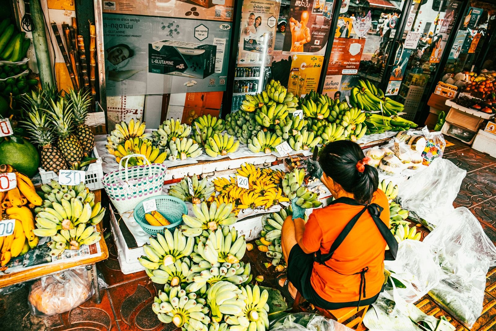 Quiet Thai street market in morning light, showing everyday living costs in Thailand