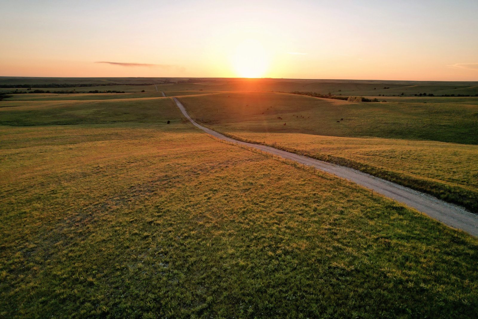 Country road at dusk with fading light, illustrating how the Roth IRA contribution limit tapers across the phase-out range